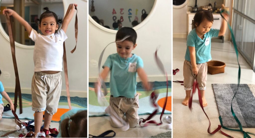 three kids playing with ribbon